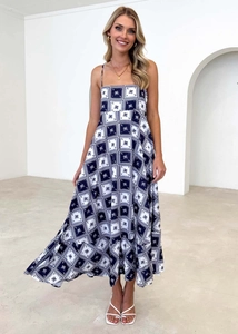 Detail of blue and white square palm print on a square neck bohemian maxi dress