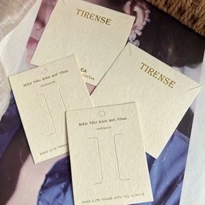 Textured off-white specialty paper jewelry display cards for earrings and necklaces