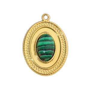 Macro detail of oval gold pendant with malachite stone inlay and textured grid bezel
