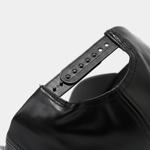 Close-up of black PU leather baseball cap with adjustable plastic snapback fastener