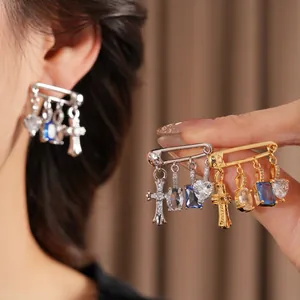 Silver needle earrings with zircon heart and cross charms in gold and silver finishes