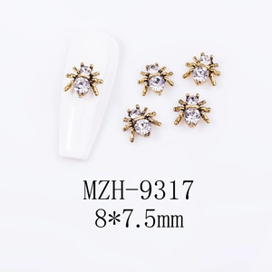 Detailed view of 8x7.5mm gothic spider nail charms with large zircon and vintage gold finish