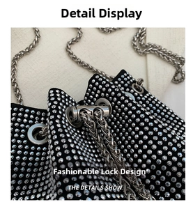 Detail of silver rhinestone bucket bag with secure metal lock and chain strap