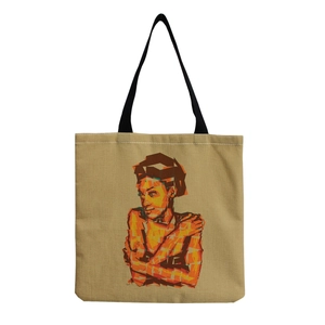 Detail of artistic woman portrait print on reusable beige canvas tote bag with black handles