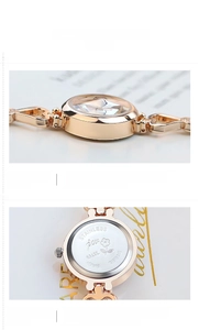 Detailed macro view of the rose gold alloy case and stainless steel floral engraved back