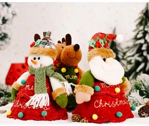 Detailed view of plush Christmas doll decorations featuring Santa, snowman, and reindeer