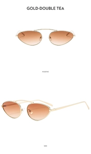 Detail view of gold metal cat-eye sunglasses with gradient tea lenses and double bridge