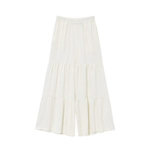 Detailed flat lay of beige tiered wide-leg pants with elastic waist and ruffle layers