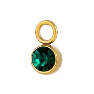 Close-up of circular emerald green gemstone pendant with polished gold setting