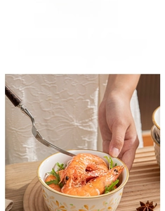 Close-up of food-safe ceramic bowl with floral glaze pattern showing high durability