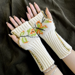Women's reversible fingerless knit gloves with butterfly jacquard and floral patterns