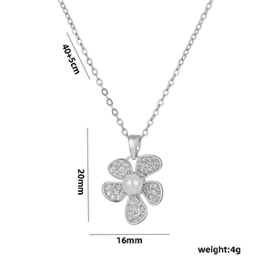 Minimalist 18k gold flower necklace with pearl and sparkling pavé crystals