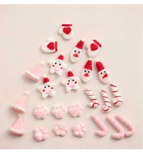 Group of festive Christmas wool felt charms including Santa, stars and canes for DIY