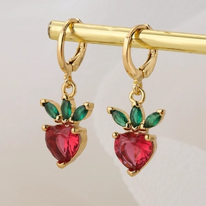 Golden earrings featuring red heart-shaped strawberry charms and green leaf gemstones