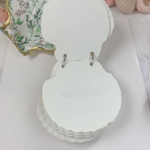 Shell-shaped loose-leaf card notebook with dual metal rings and thick white paper card