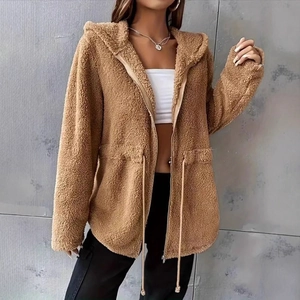Close-up of brown faux fur texture and drawstring waist on hooded jacket