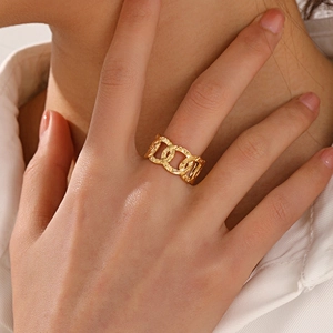 Exaggerated golden chain link ring for women with textured hammered finish detail