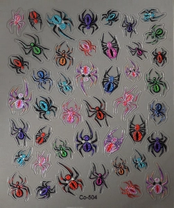 Macro detail of colorful glitter spider nail art stickers with metallic holographic finish