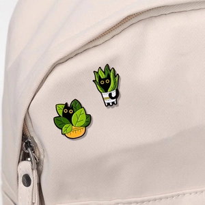 Enamel black cat plant pins set on canvas bag showing cute animal badges for bags