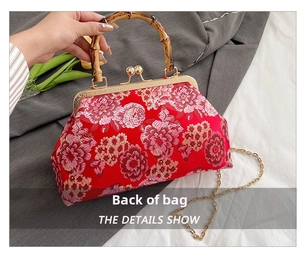 Detail view of red floral embroidery and bamboo handle on a Chinese vintage shoulder bag