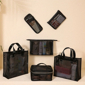 Set of 5 black mesh storage bags including tote and flat zipper pouches for travel