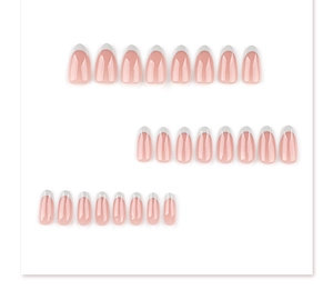 Macro view of French tip almond press-on nails set with glossy nude pink and white edges
