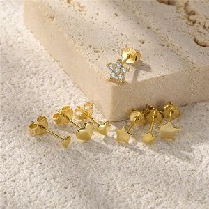 Detailed view of S925 sterling silver stud earrings set with heart and star motifs