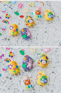 Detail of 5D embossed nail stickers featuring cute cartoon bears, rainbows and flowers