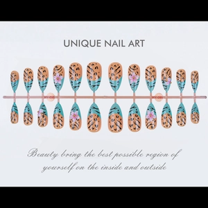 Detailed view of almond-shaped press-on nails with leopard print and 3D floral accents