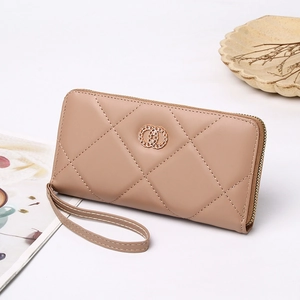 Chic beige quilted long wallet with metallic detail and strap on minimalist background