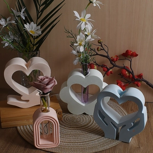 Minimalist geometric resin flower vases with heart, arch shapes and glass test tubes