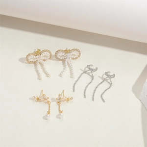 French vintage bow earrings set with pearls and zircons in gold and silver finishes