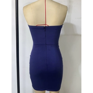 Detail of invisible zipper closure on back of slim fit dark blue mini party dress
