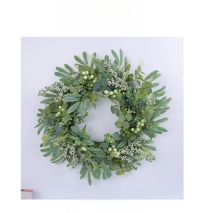 Close-up of eucalyptus wreath with white berries for seasonal door and wall decoration
