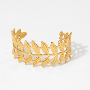 Gold laurel leaf open cuff bracelet in Greek style with polished metallic finish
