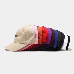 Multiple colors of 1987 embroidered baseball caps in cotton canvas stacked together