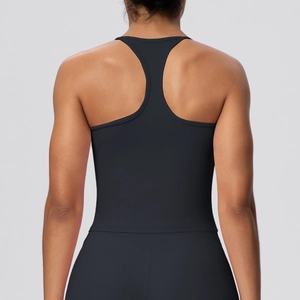 Detail of solid black racerback yoga tank top with elastic performance fabric