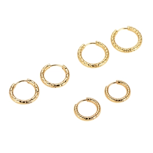 Three pairs of vintage gold hoop earrings with hammered metal and twisted rope designs