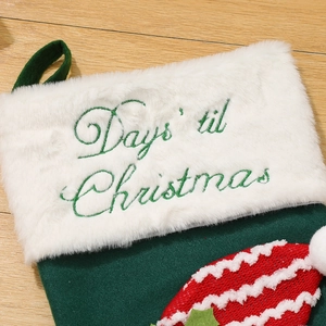 Green velvet Christmas stocking with Days til Christmas embroidery and white faux fur trim