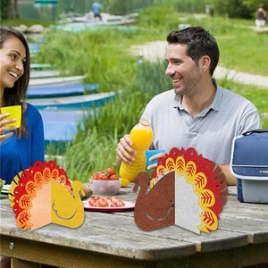 Set of two glittery paper turkey decorations in gold and brown for Thanksgiving table