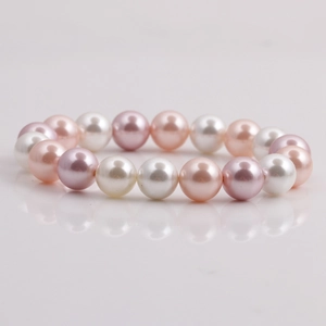 Detail view of multi-color shell pearl bracelet with pink, white and purple beads