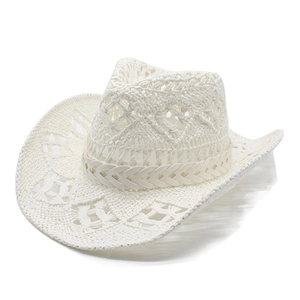 Macro view of white woven straw cowboy hat featuring hollow diamond pattern detail