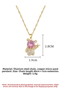 Detail of bear pendant with pink gemstone and rhinestones on gold titanium steel chain