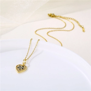 Golden stainless steel heart necklace with black flower enamel and zircon pendant