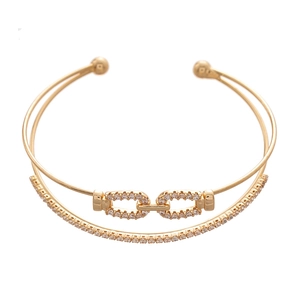 Golden double-layer open bangle featuring pavé zircon links and minimalist smooth band