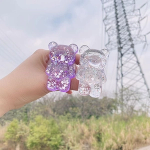 Glittering bear-shaped folding phone stand in purple and transparent resin finishes