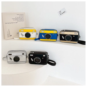 Detailed view of mini camera shaped crossbody bags in five stylish color combinations