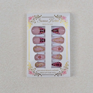 French Y2K press-on nails set with pink leopard print and gold heart details