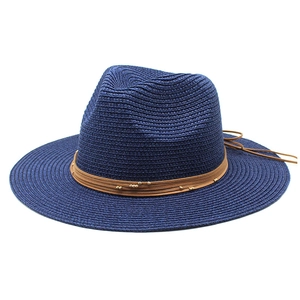 Detail showing deep blue wide-brim straw hat with brown leather cord and gold beads