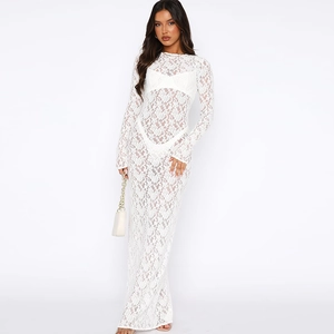 Detail of the elegant white floral lace pattern on this see-through slim maxi dress